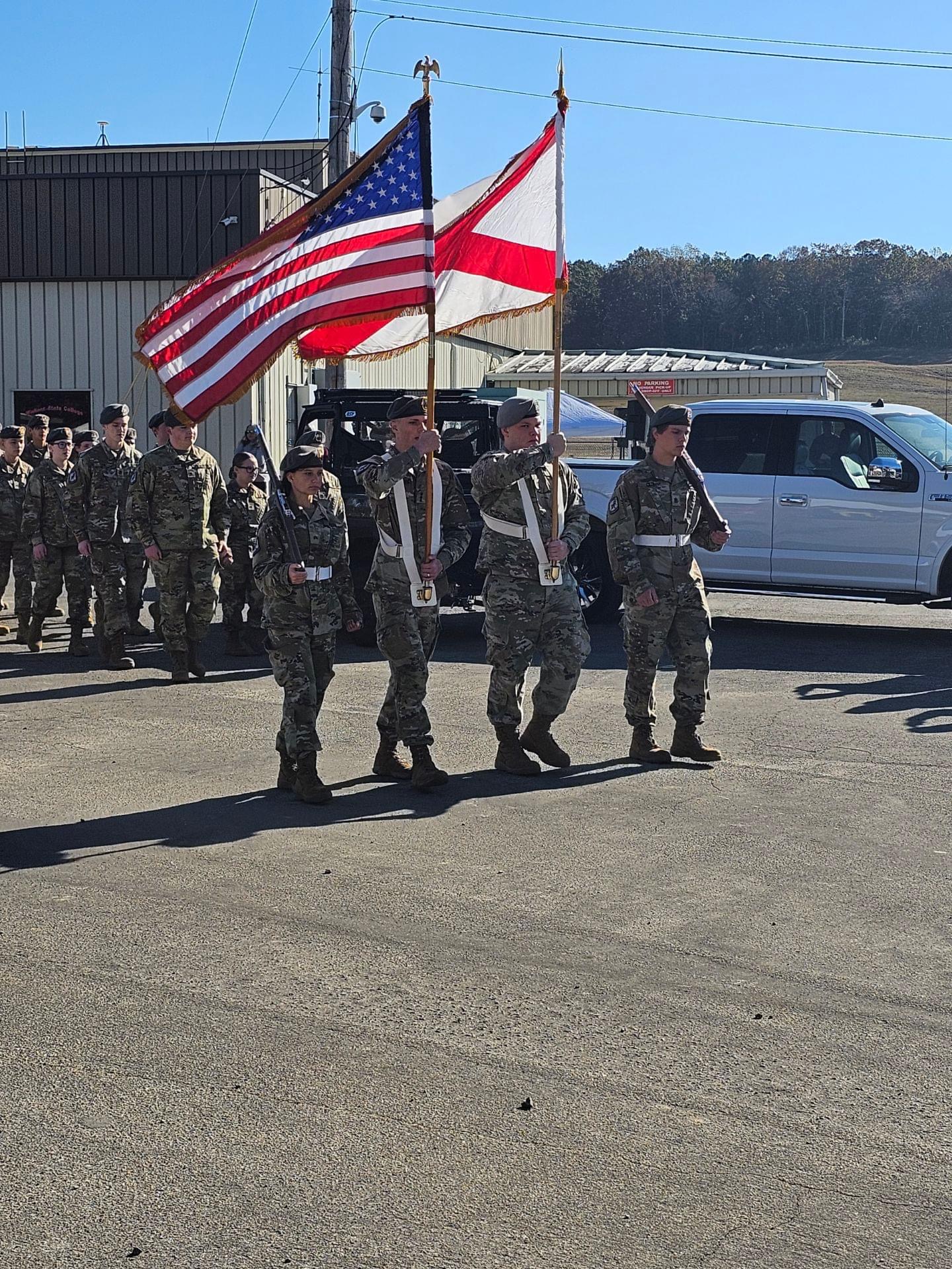 Veterans saluting during ceremony